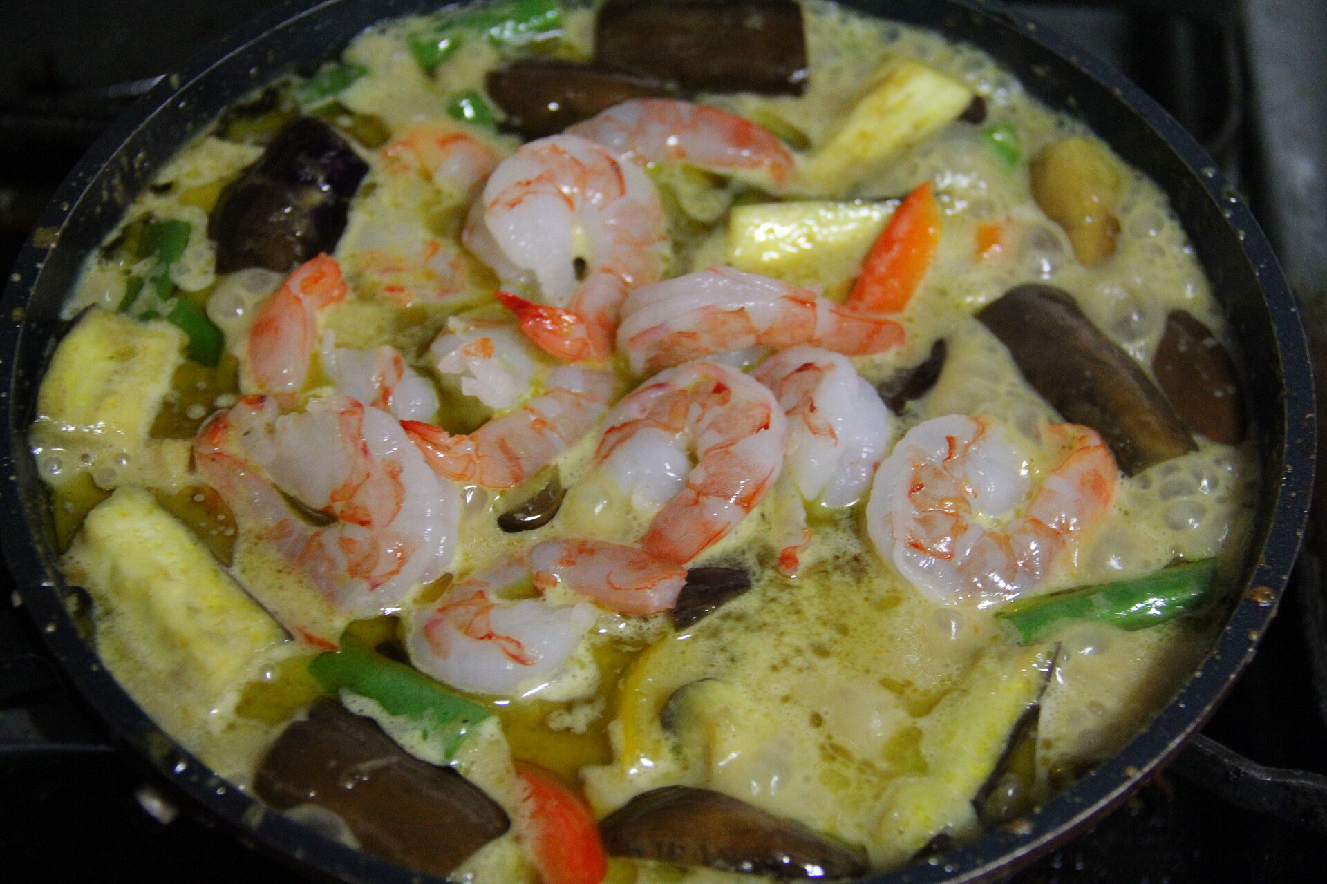 Shrimp and vegetables in a curry, still in the pan